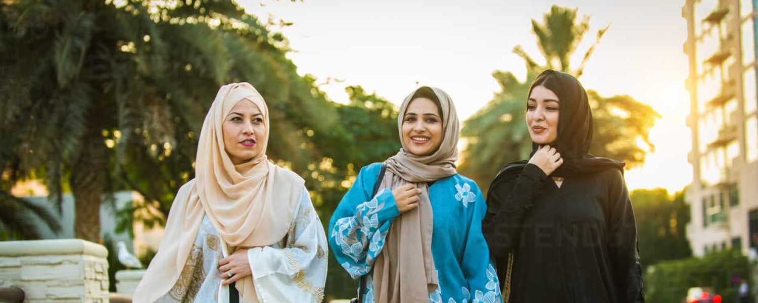 Walking women in abayas