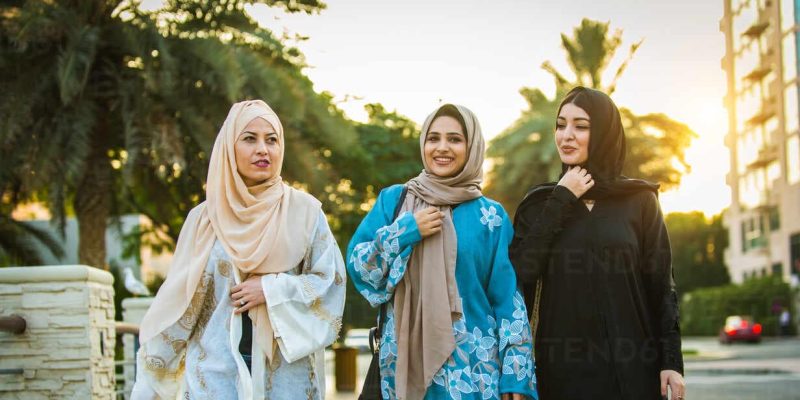 Walking women in abayas